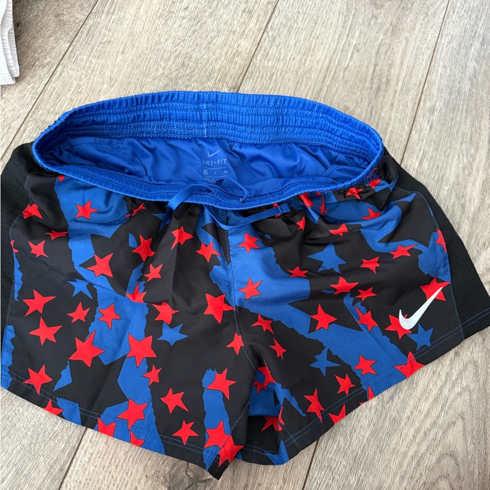 Nike Black Shorts with Blue and Red Star Design